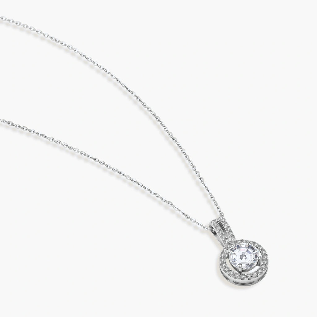 Platinum-plated sterling silver necklace with round halo pendant featuring central crystal surrounded by smaller stones
