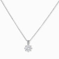 Platinum-plated sterling silver necklace with round clear crystal pendant and decorative bail on neutral background.