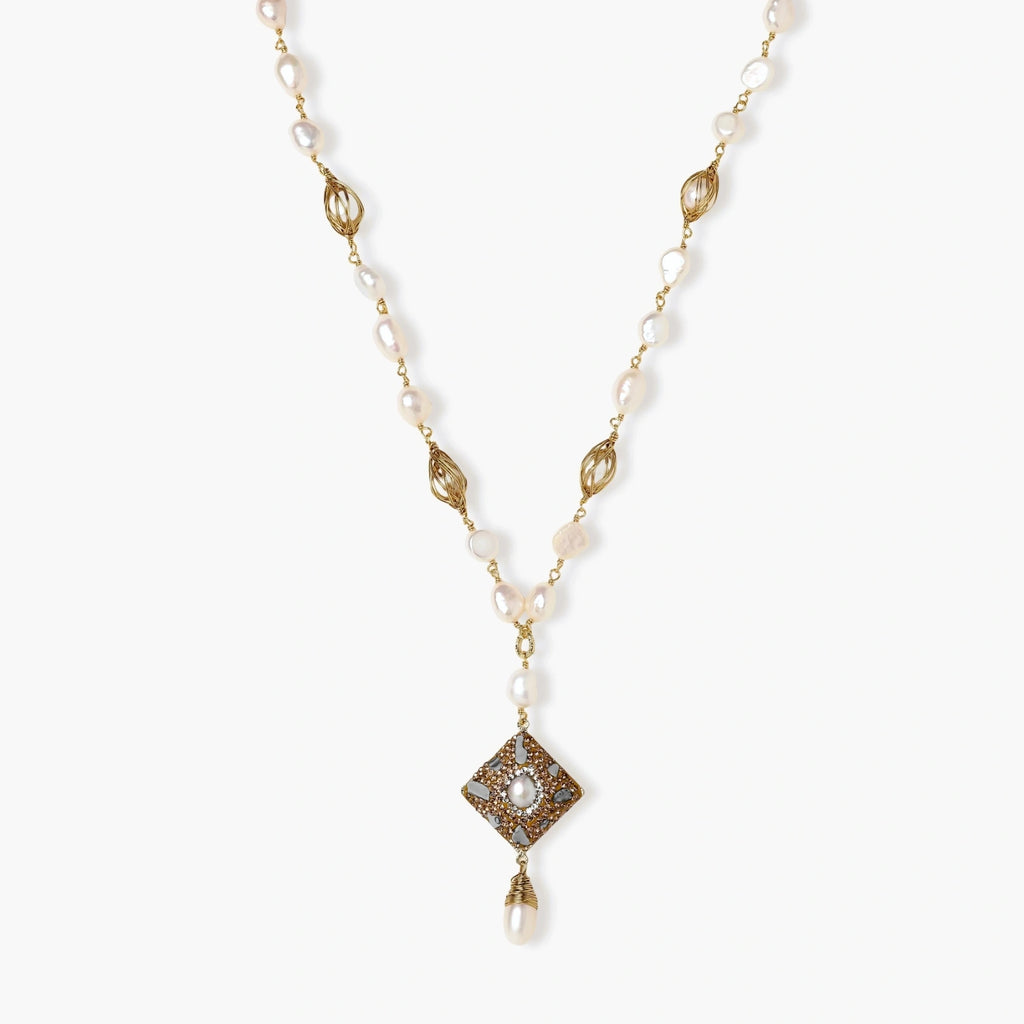 Y-shaped necklace with freshwater pearls, gold filigree stations, and ornate diamond-shaped centerpiece with pearl drop